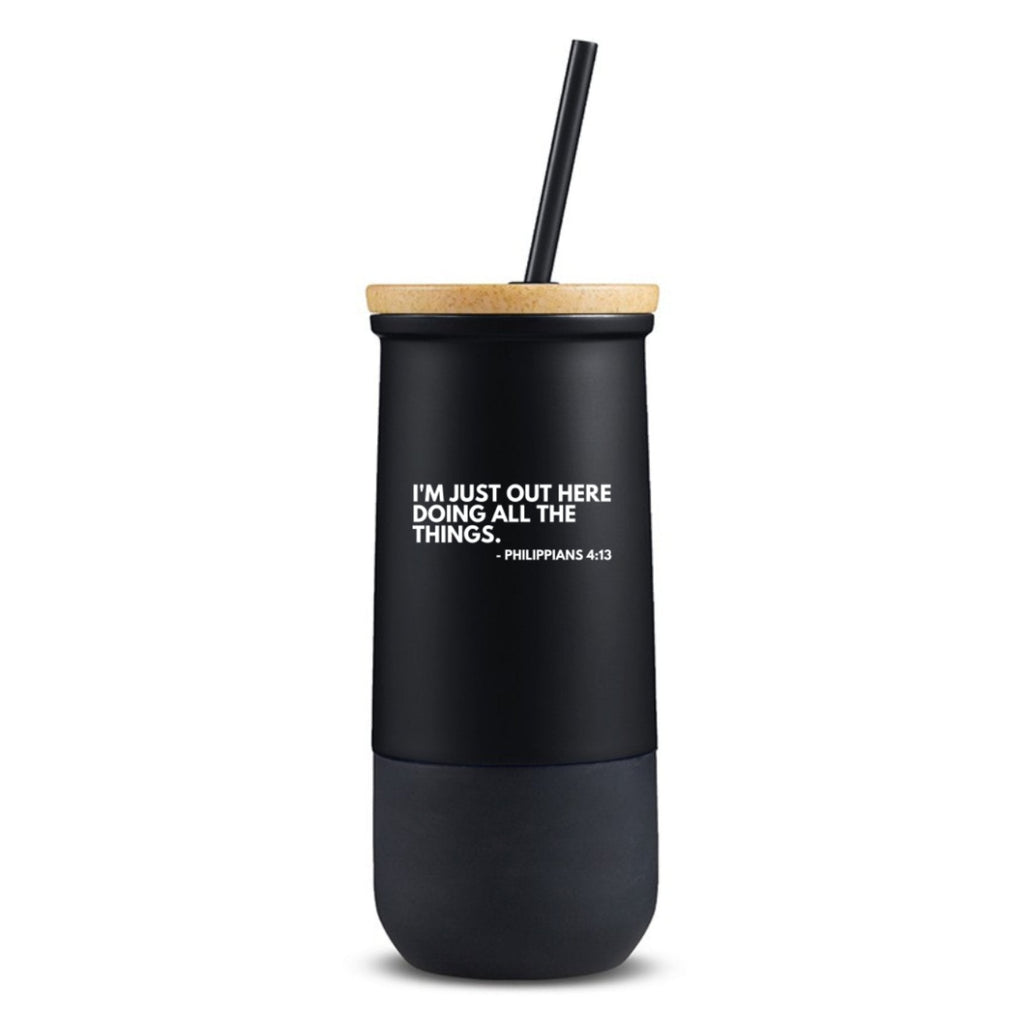 White and black stainless steel tumbler with phrase "heavy on the protecting my peace"
