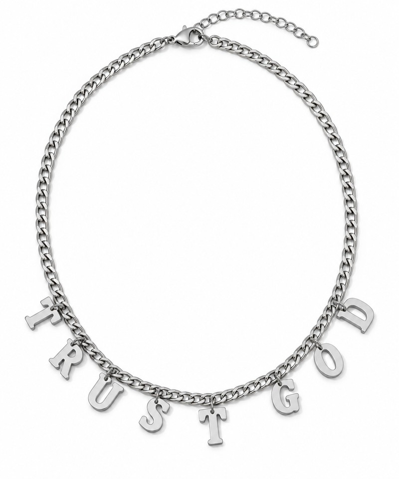 A silver-toned chain necklace with dangling letter charms spelling out 'TRUST GOD' on a plain white background.